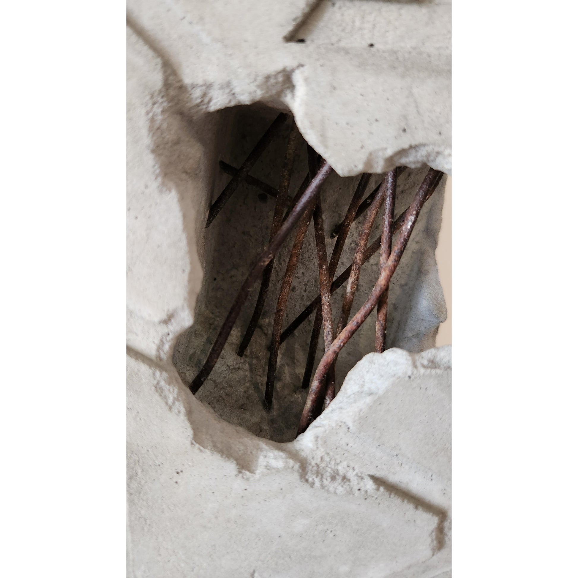 Concrete block with embedded metal rods