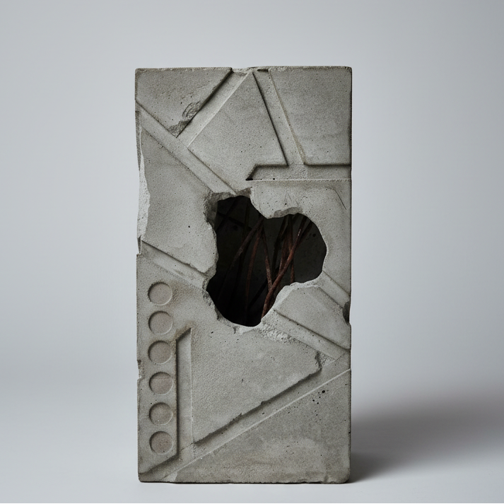 Concrete block with geometric design on a gray background